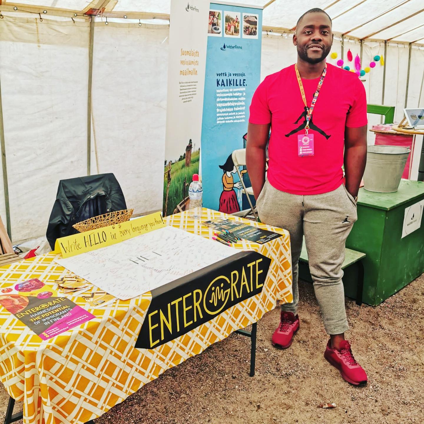 Entergrate representative welcoming visitors at the World Village Festival