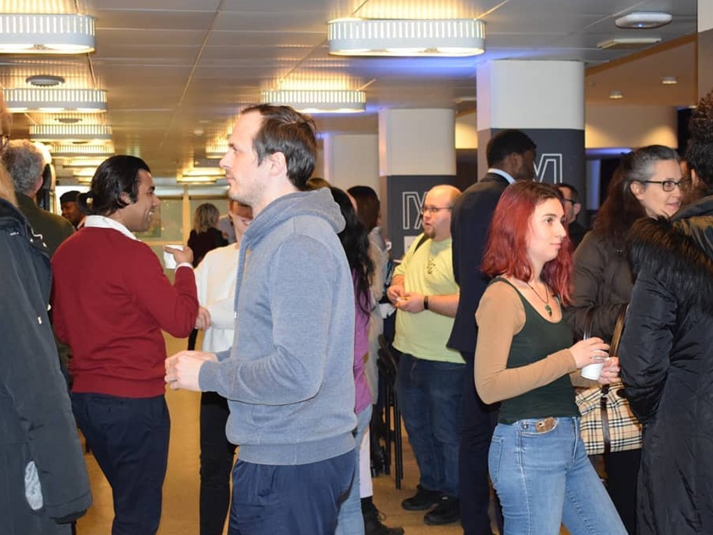 Entergrate community members talking at an event