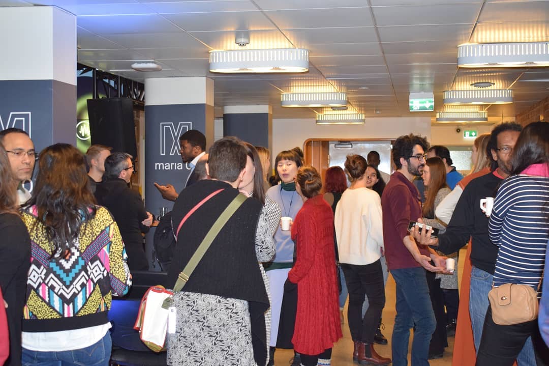 A diverse group networking at an Entergrate gathering