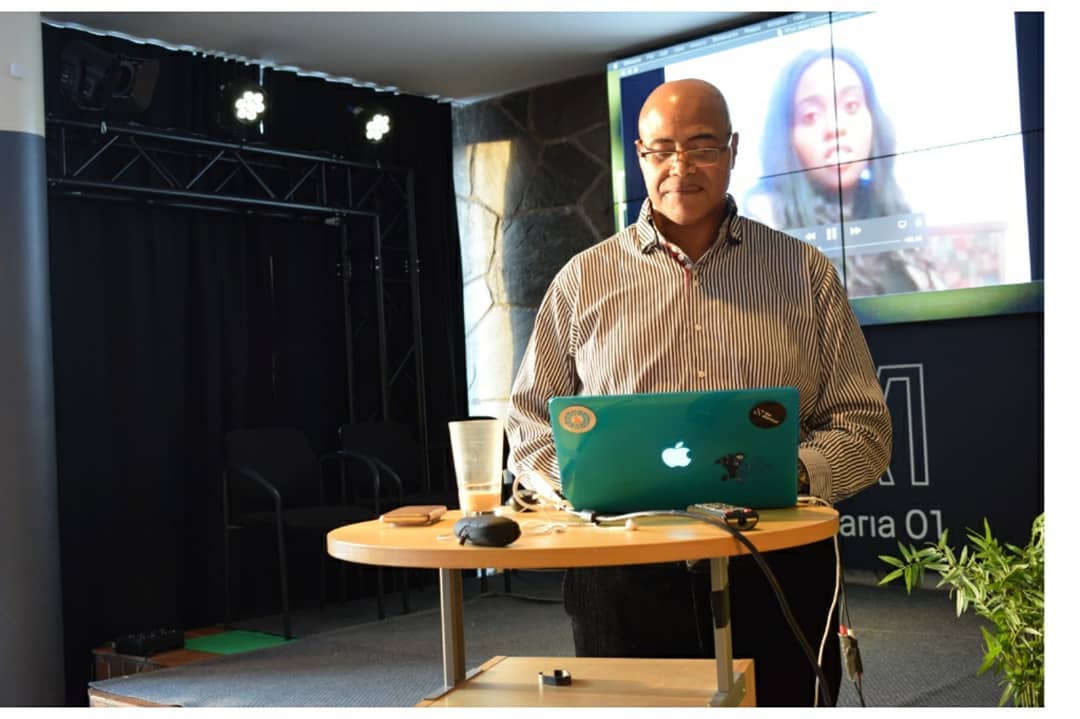 A speaker presenting at an Entergrate community event